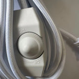 Close-up of the inline rotary dimmer on the white cord