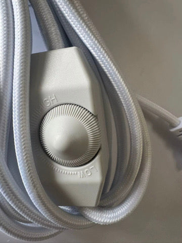 Close-up of the inline rotary dimmer on the white cord