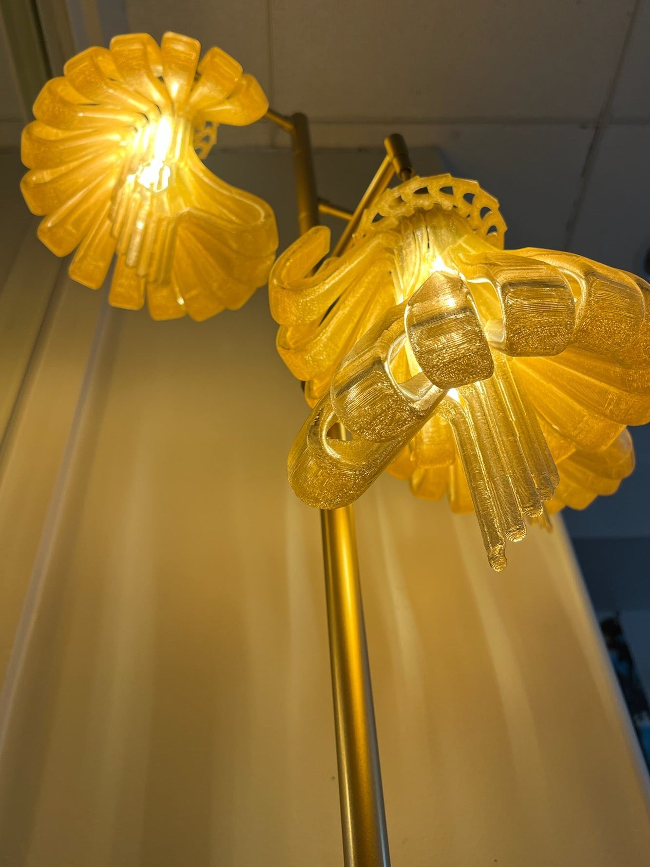 Arise Arbor Floor Lamp, amber shades glowing