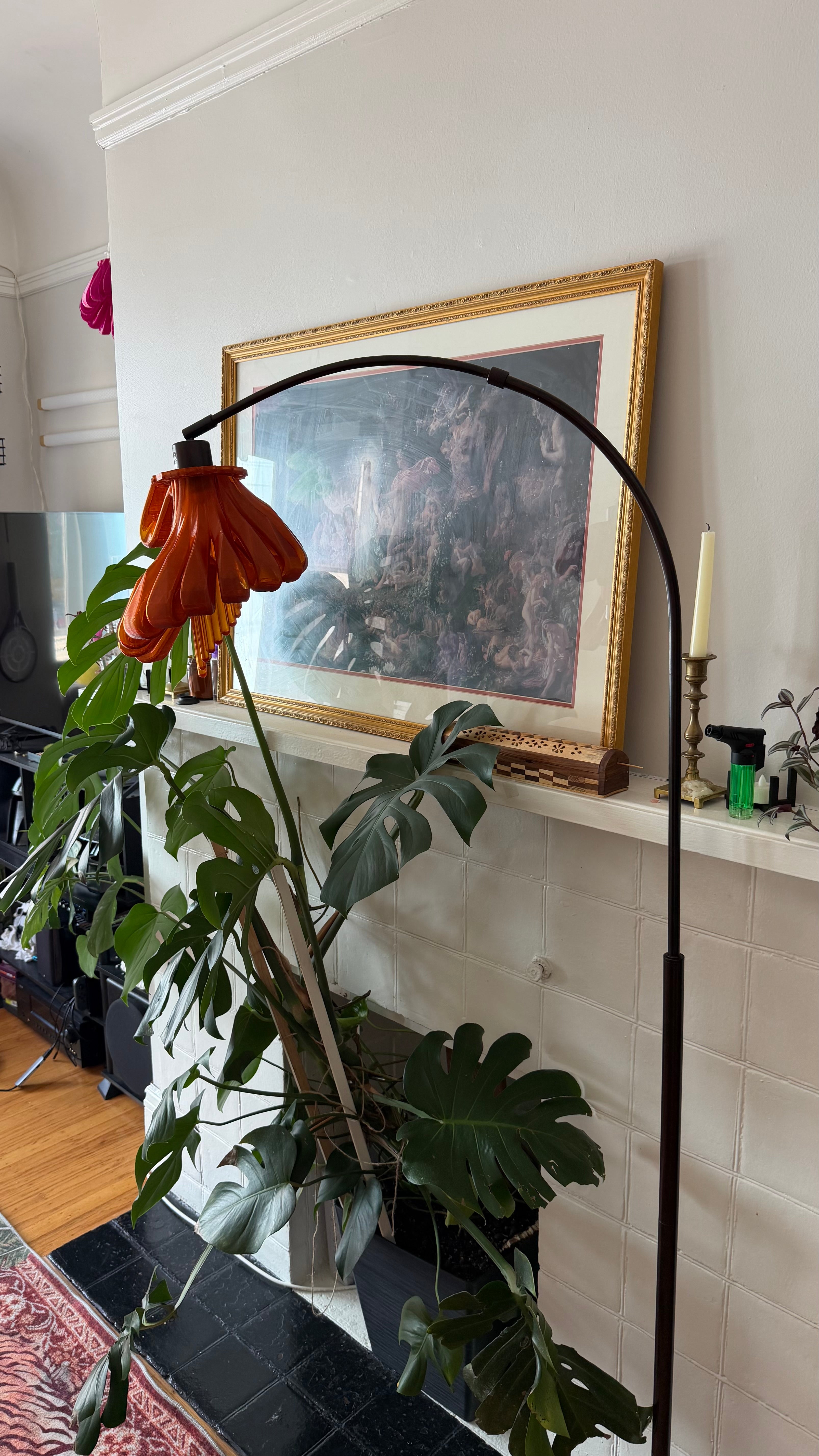 Arc Arise Standing Lamp with black base in a living room