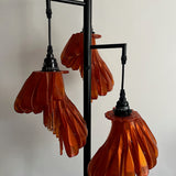 Arise Arbor Floor Lamp, black base with three amber orange shades