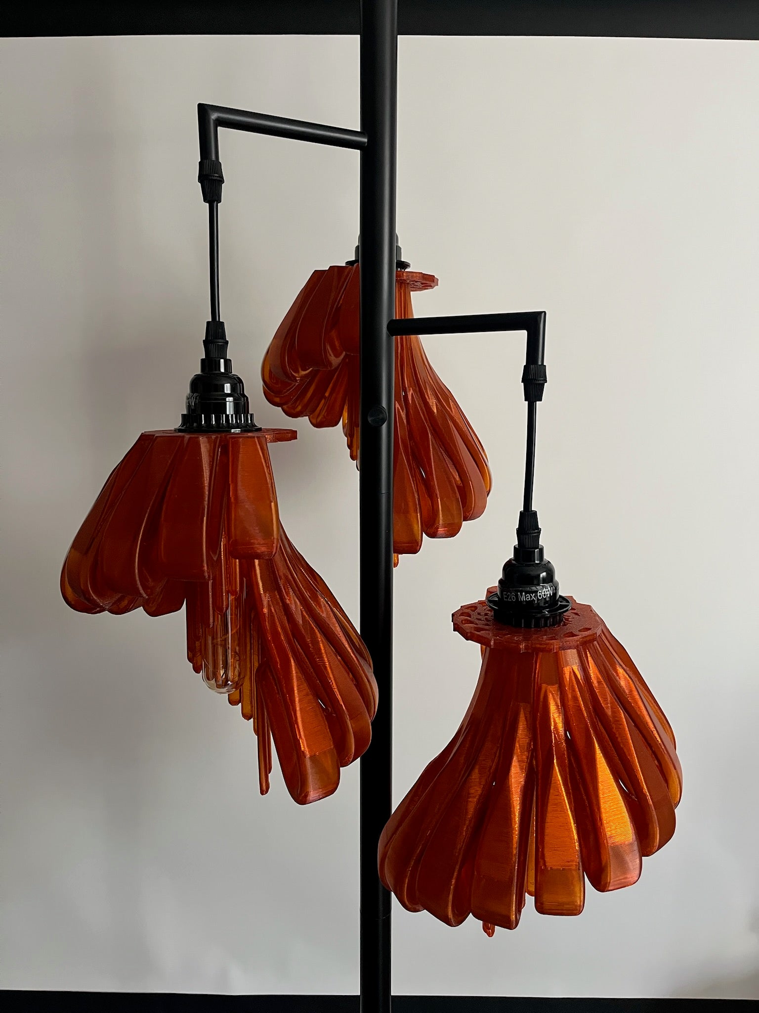 Arise Arbor Floor Lamp, black base with three amber orange shades