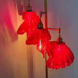 Arise Arbor Floor Lamp, red shades lit against a wall