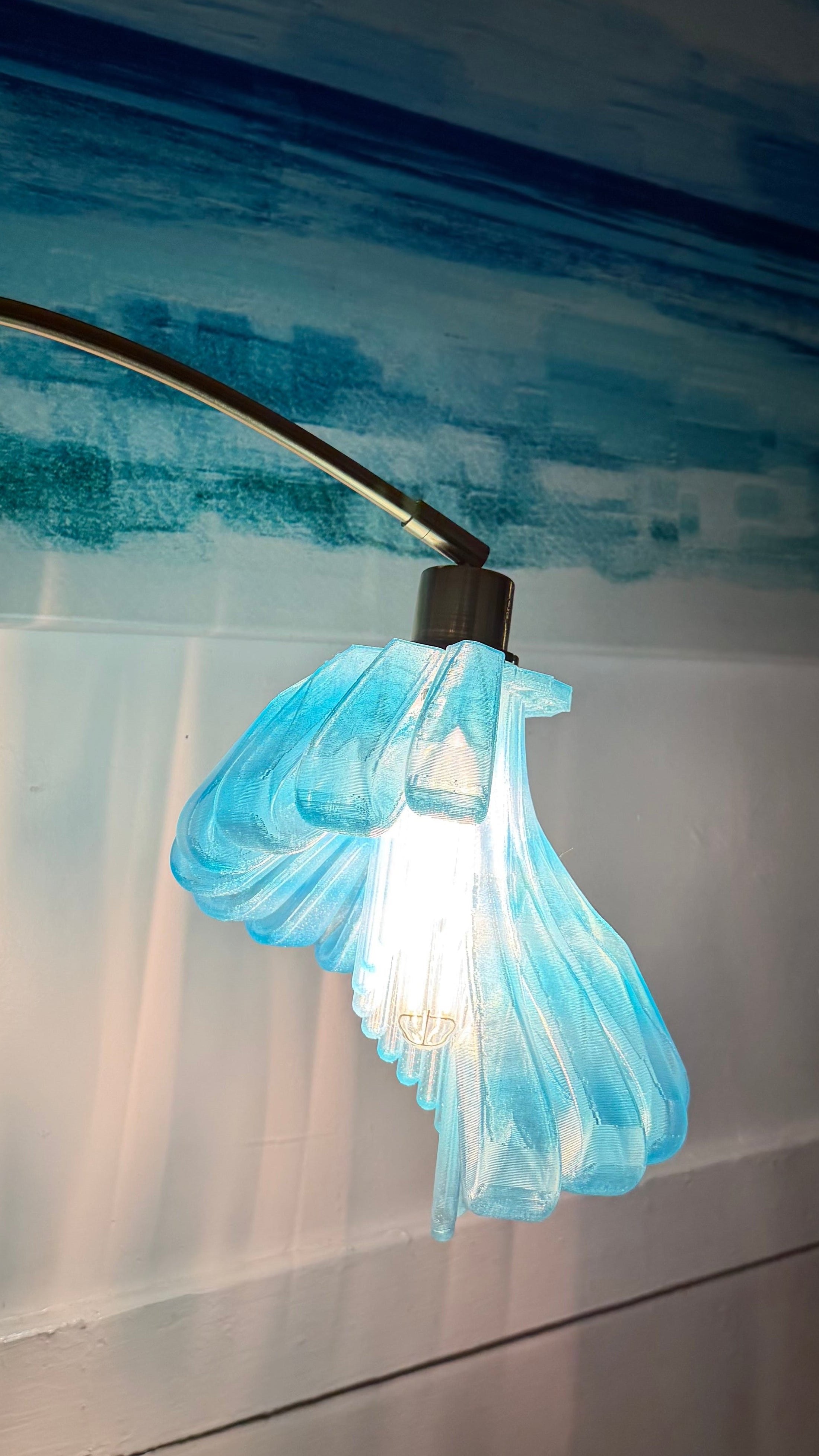 Arc Arise Standing Lamp, blue shade lit close-up